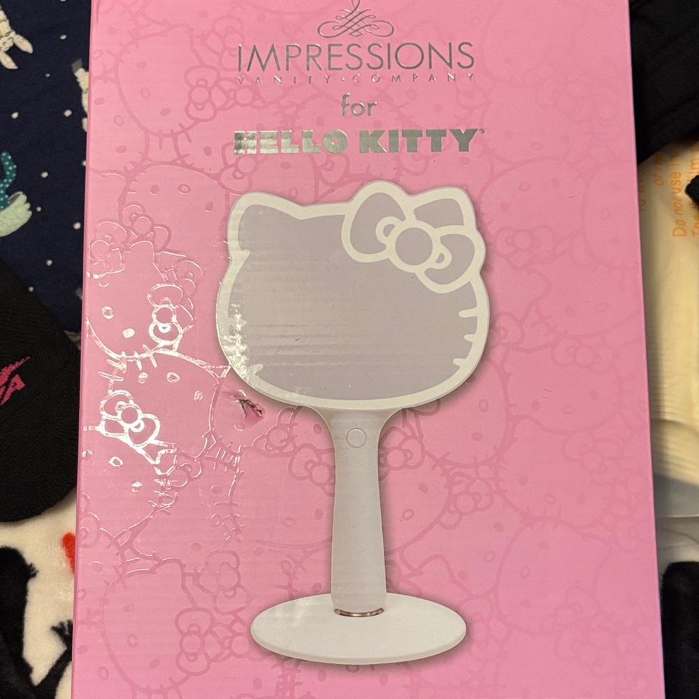 Impressions Vanity Hello Kitty Hand Mirror - Pink. New in box